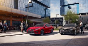 2 2019 Toyota Corolla's in front of a downtown building.